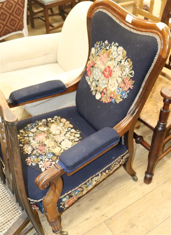 A Victorian embroidered upholstered elbow chair